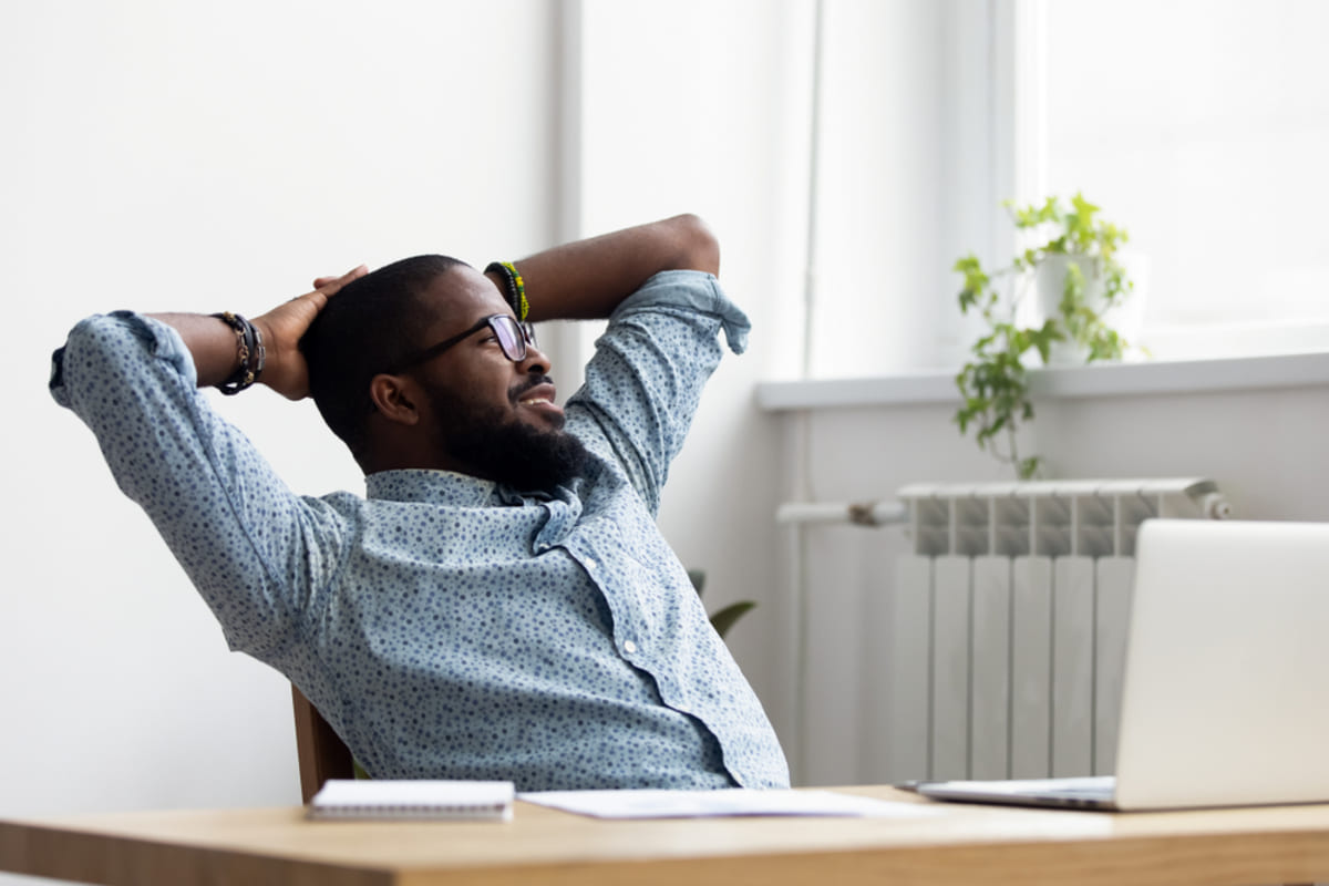 A man sitting back in his chair