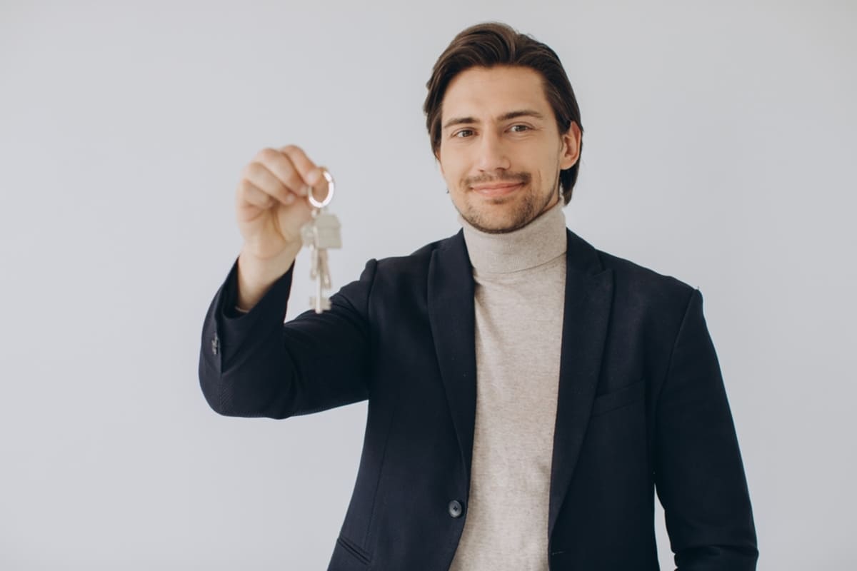 Professional Property Manager Showing Keys In Hand