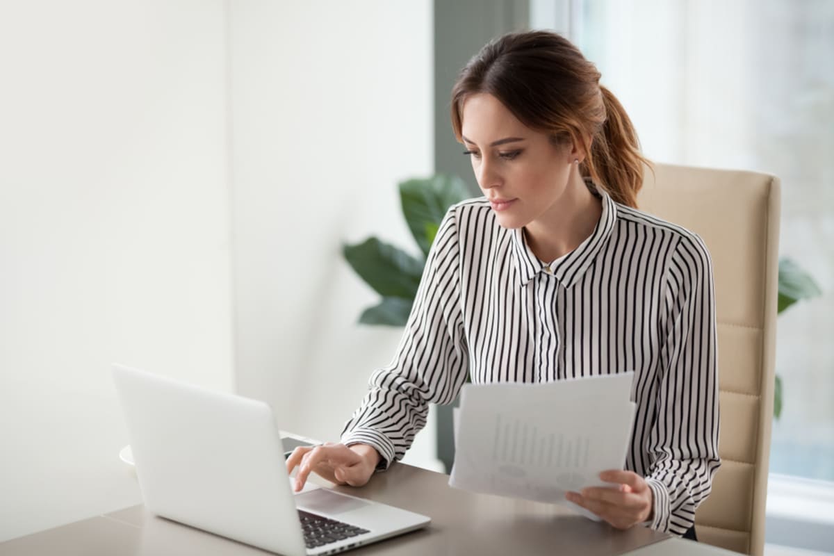 Serious focused businesswoman running tenant screening