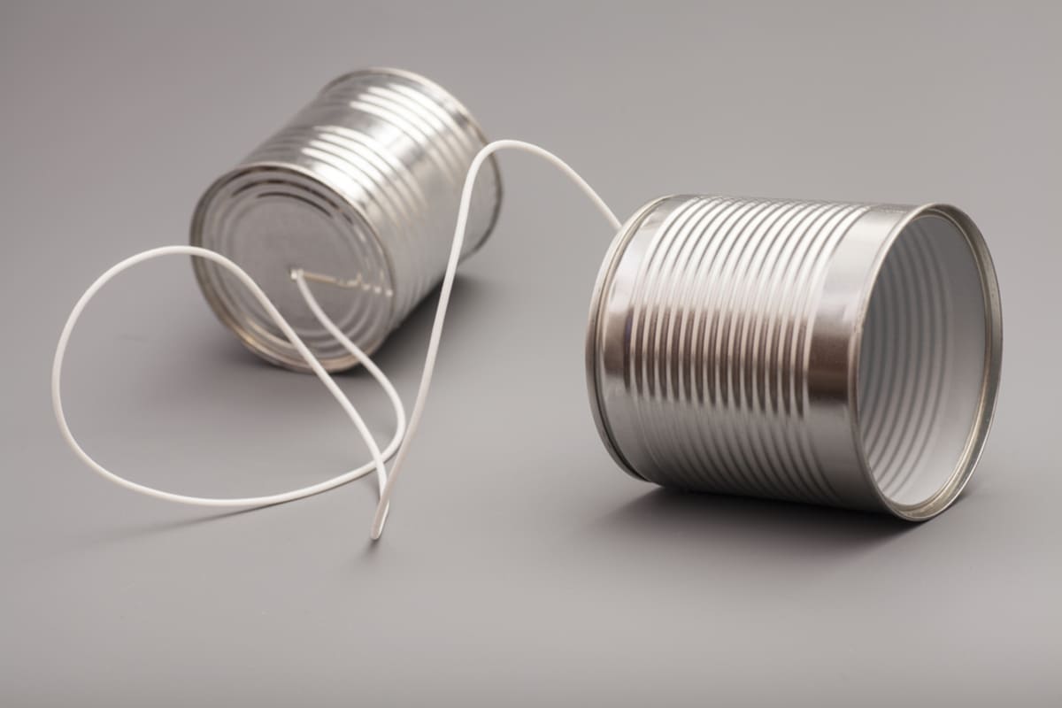 Tin cans ties together with string, communication for effective tenant retention strategies