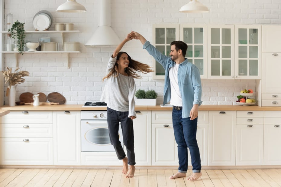 Two people dancing in their home, successful tenant retention strategies concept