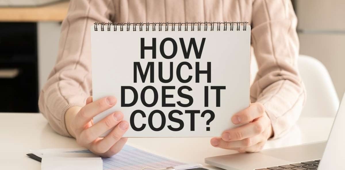 How much does it cost text written in the notebook in hand 5
