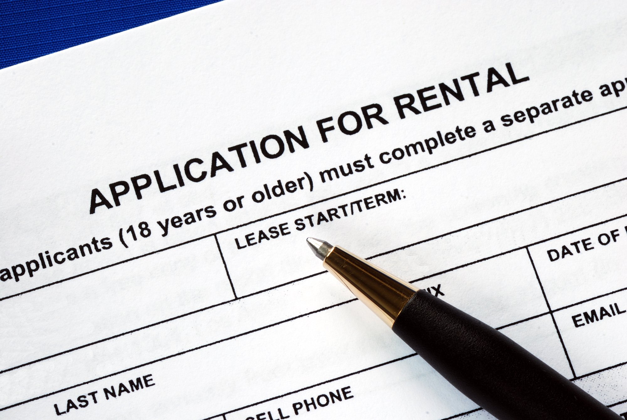 Photo of a rental application and pen. 