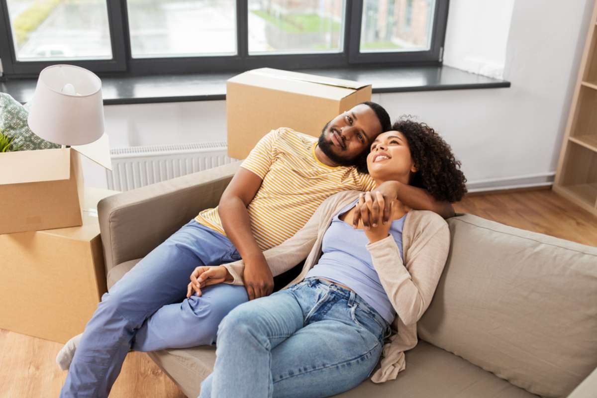 A happy couple in a home, how much can I rent my house for concept