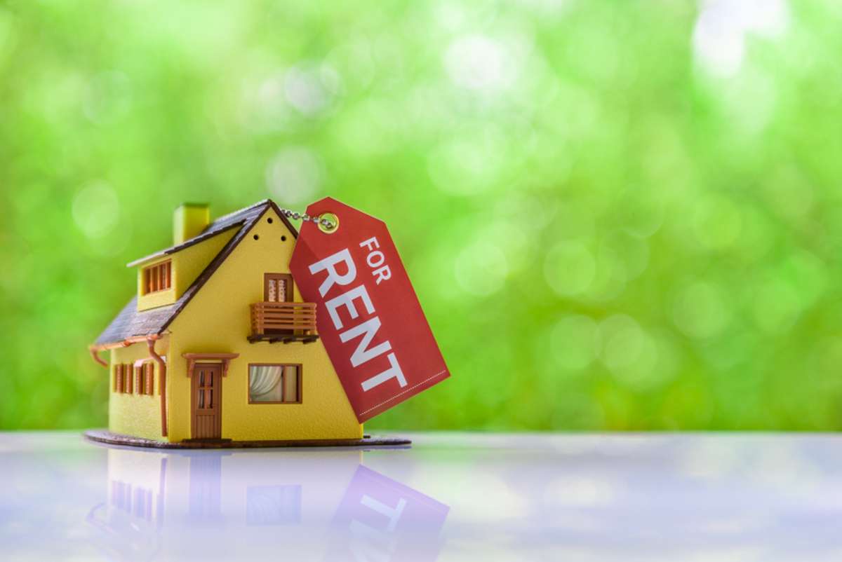 Small house model with For Rent sign, Charleston property managers concept