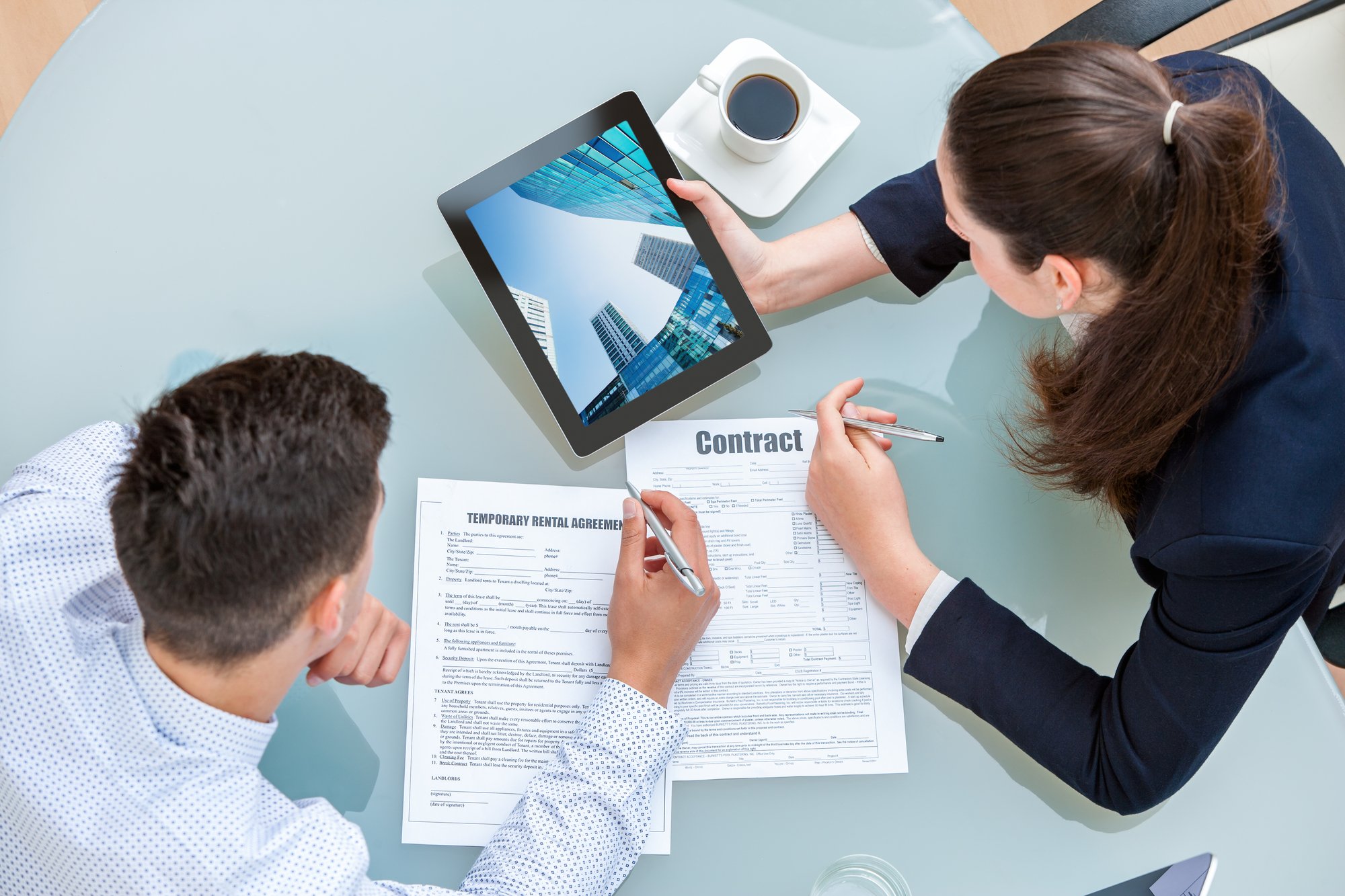 Young business couple discussing rental agreement