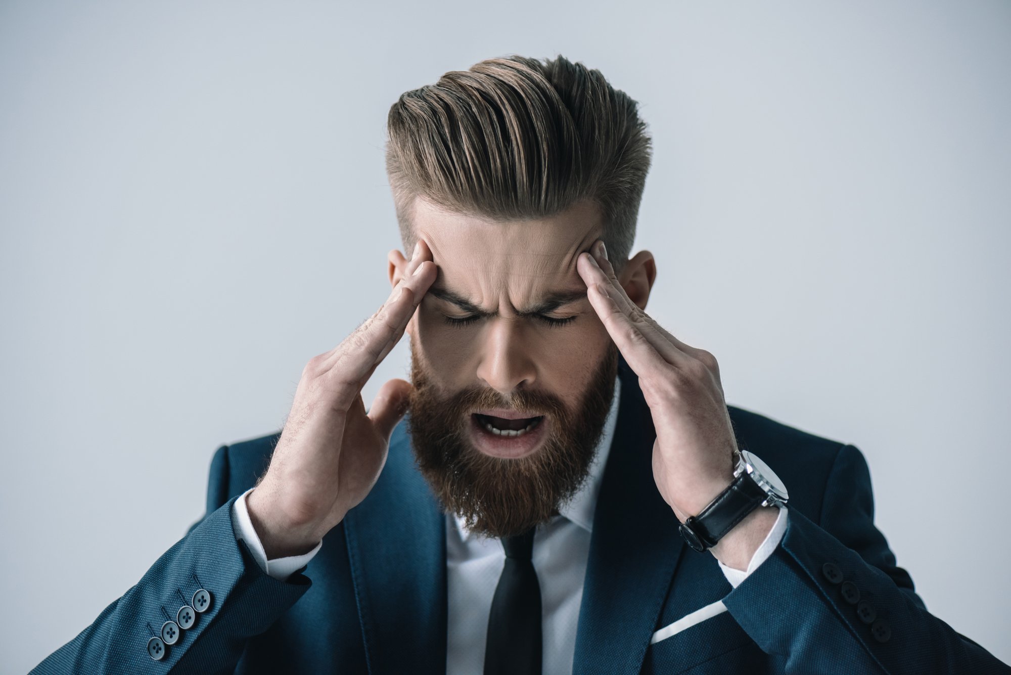 Young businessman with headache