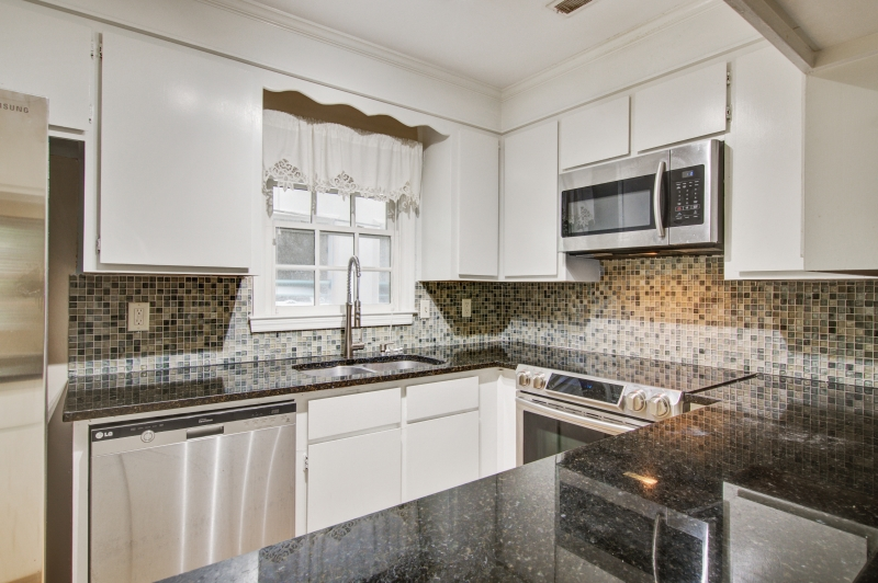 A clean, updated kitchen as part of the preparing property for rental process. 