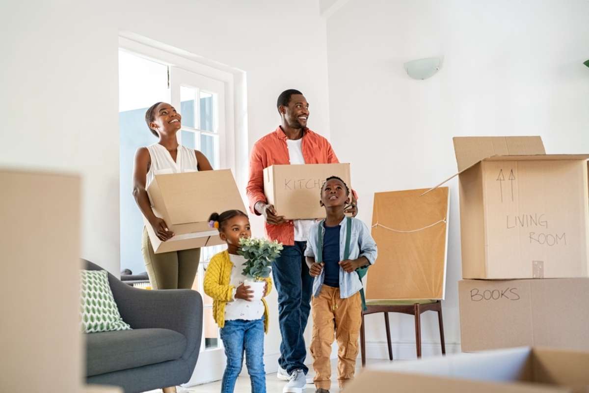 Happy family moving into a home, property management services concept