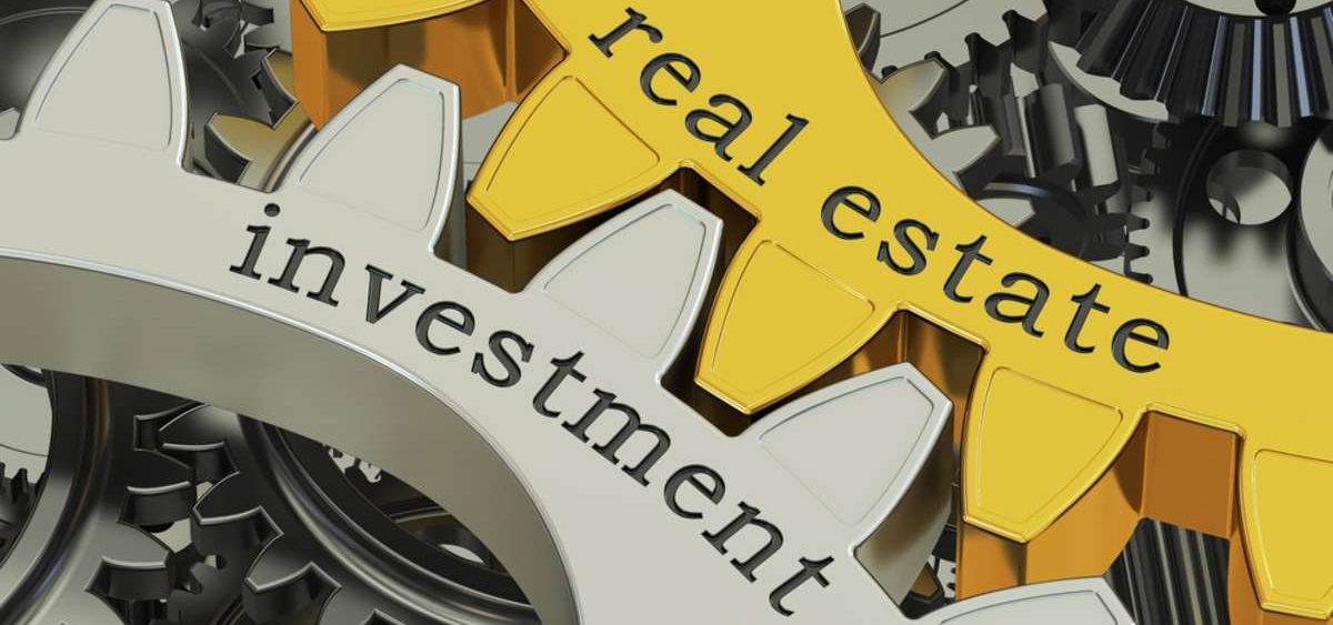 real estate investment concept on the gearwheels 2-1