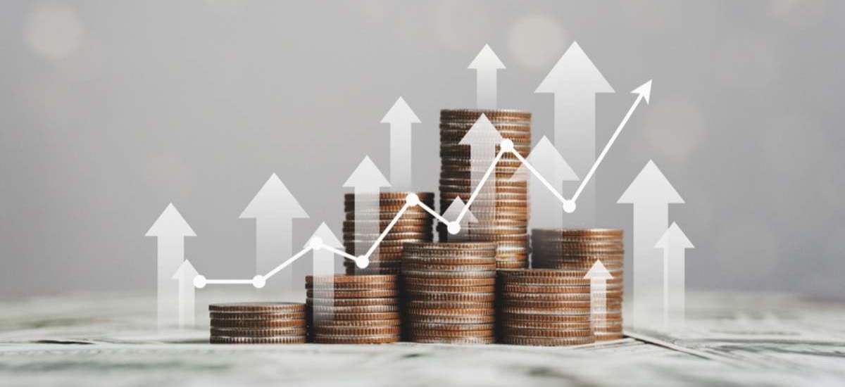 stack of silver coins with trading chart in financial concepts and financial investment business stock growth